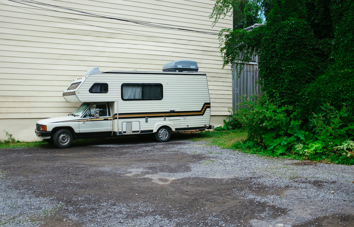 white and brown RV