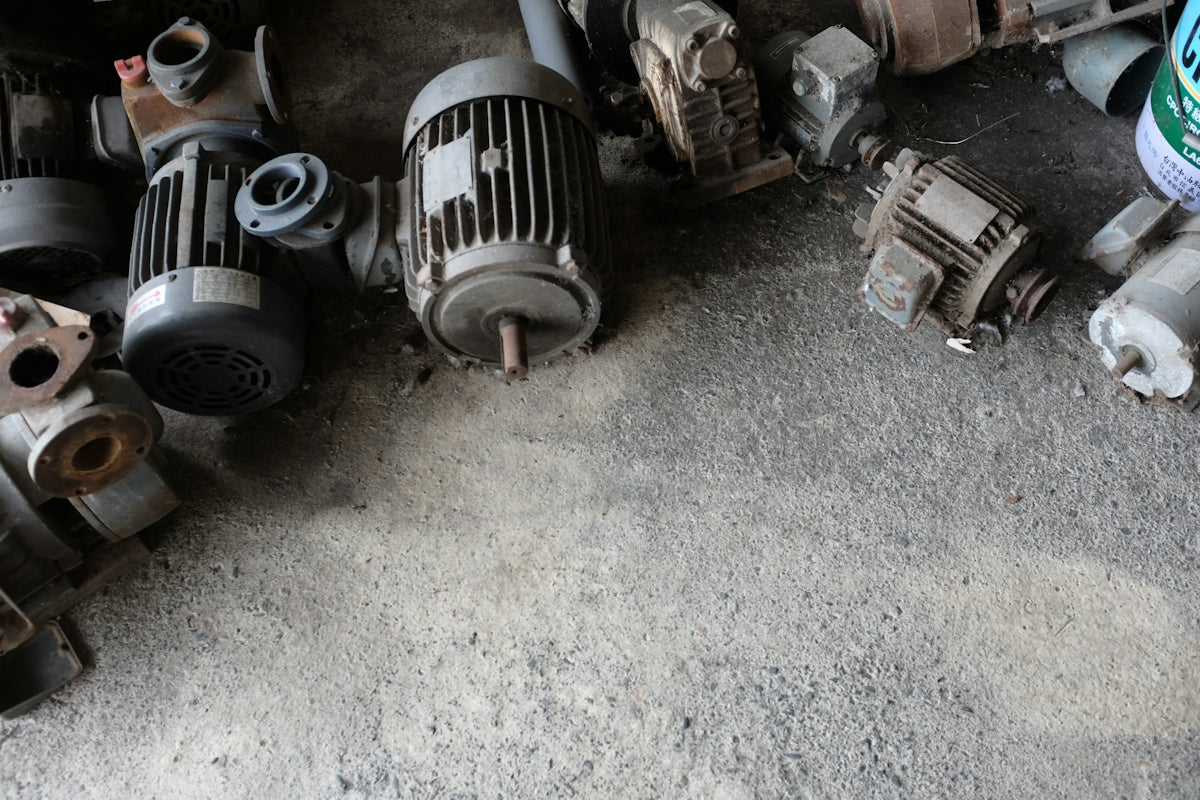 a group of motor parts sitting on the ground