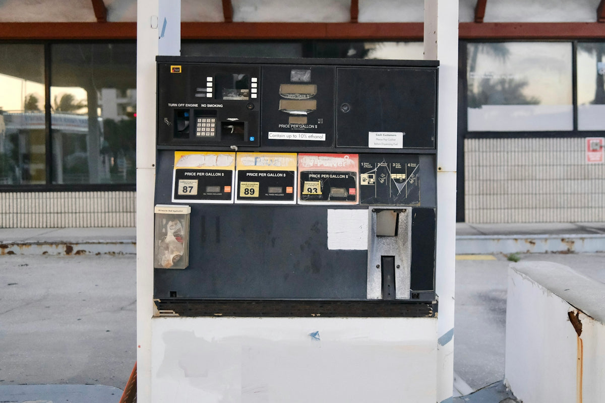 an old gas pump in front of a building