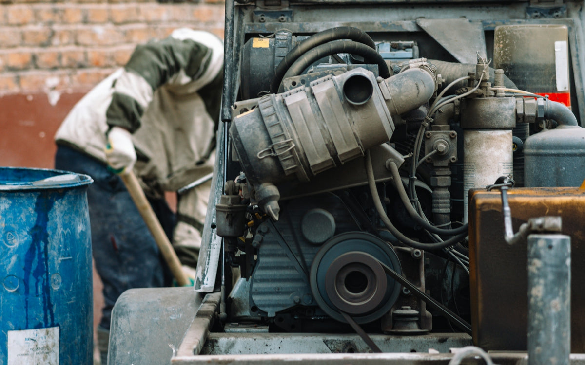 a man is working on a truck engine