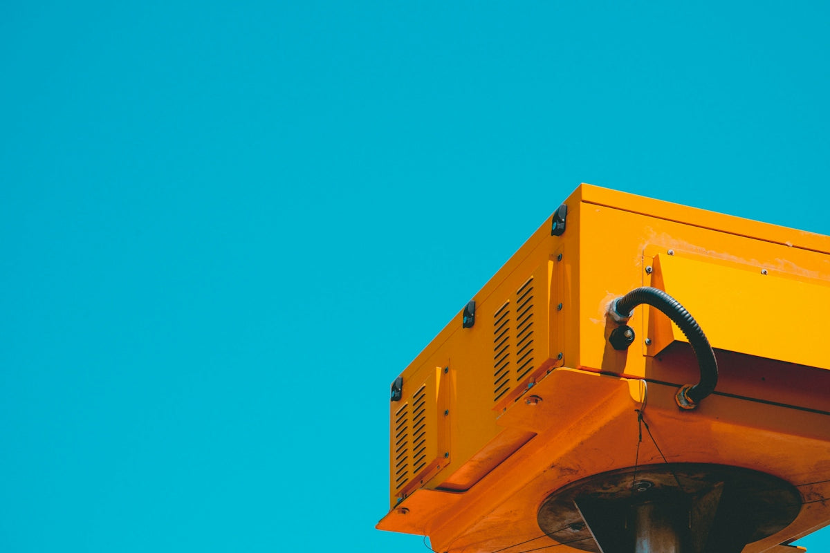 a yellow house with a blue sky