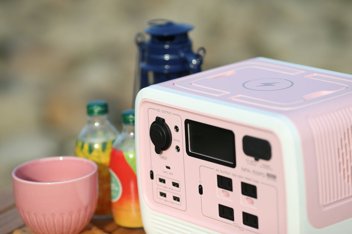 a white and pink electronic device with bottles of liquid on the side