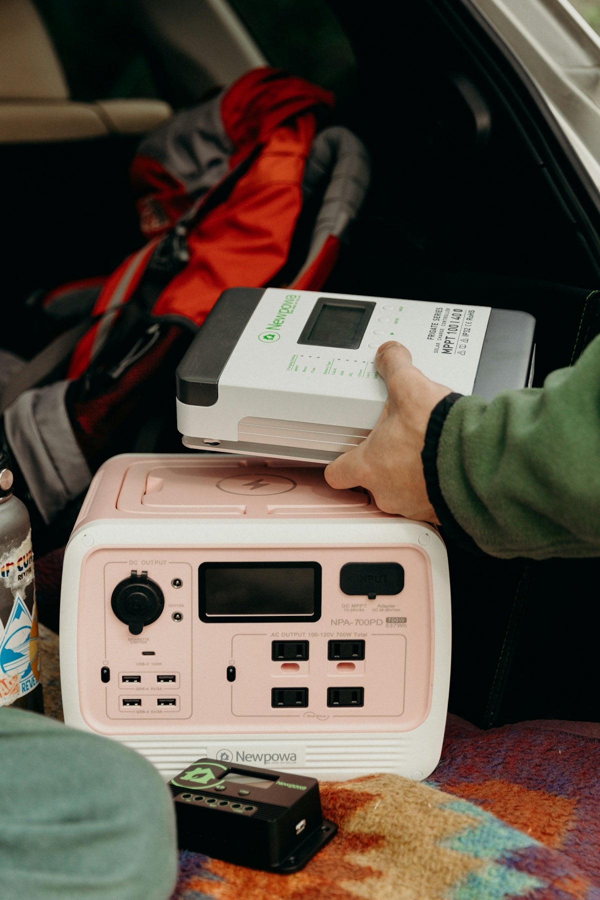 a pink radio sitting in the back of a car