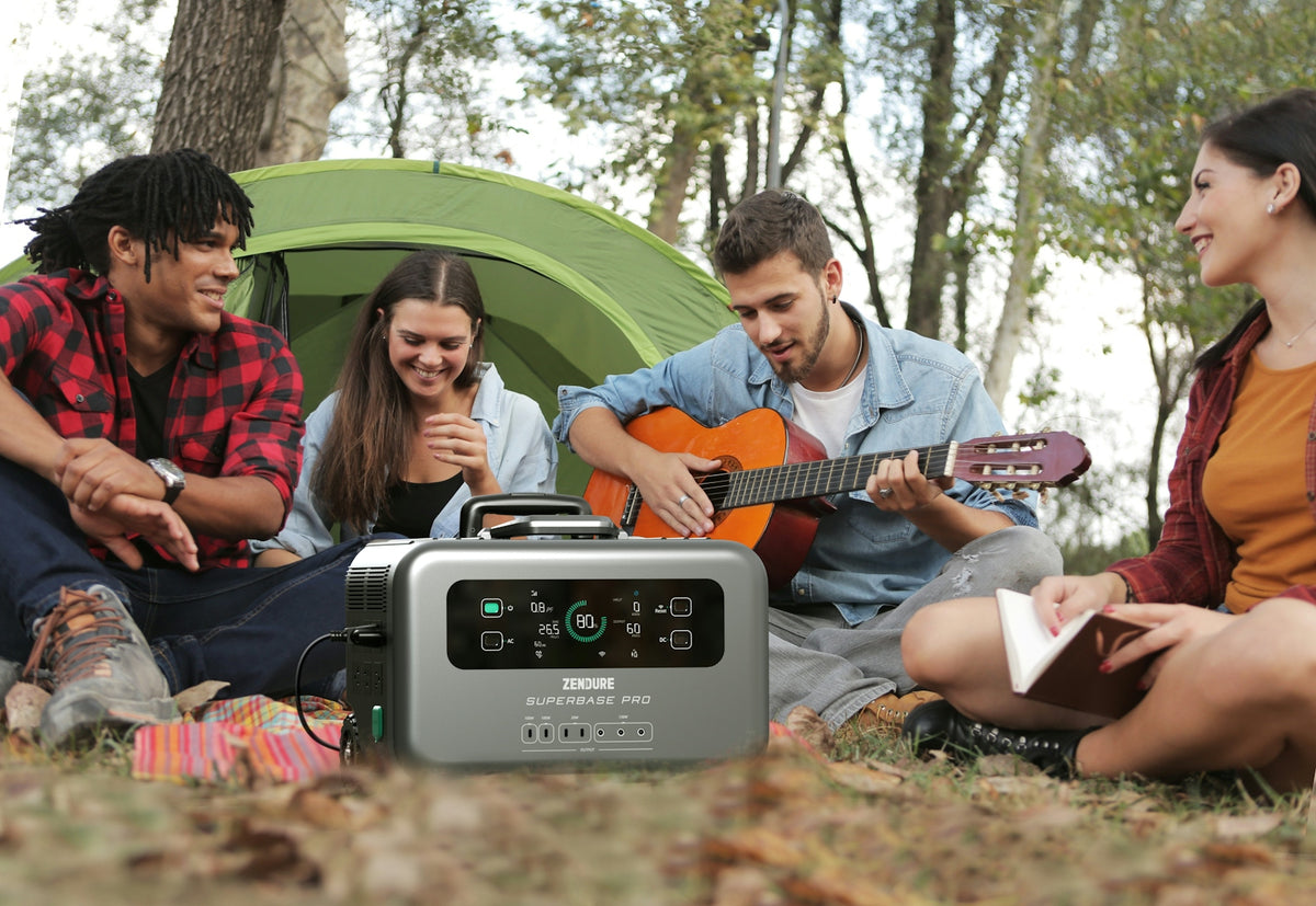 a group of people sitting on the ground playing guitar