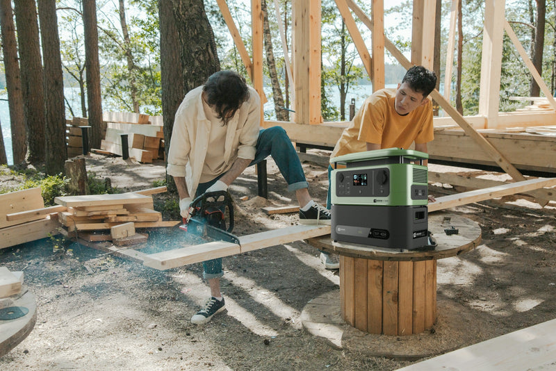 two people working on a project in the woods