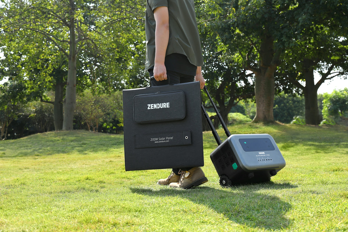 a man with a suitcase and a radio in the grass
